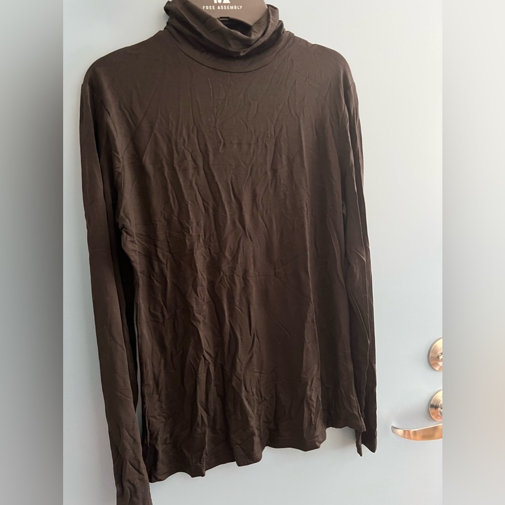 Basic black long sleeve w/ turtleneck. Size M. *wrinkled bc folded up*